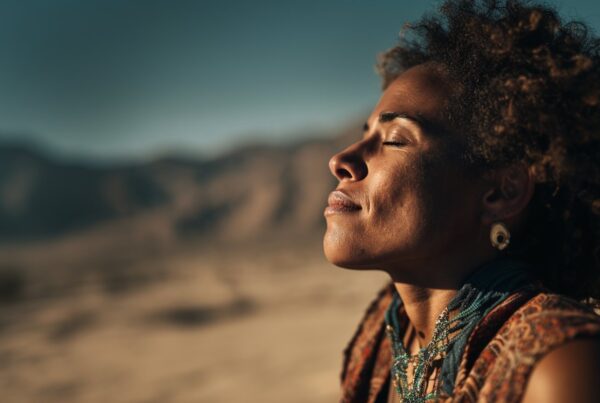 A serene woman with eyes closed basks in the desert sun, symbolizing calm contemplation on whether crossfading is bad.